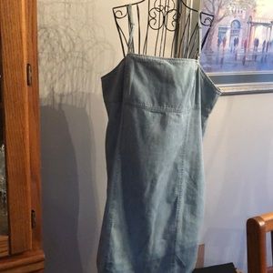 Retro Jean dress with adjustable spaghetti straps and zipper back.